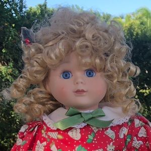 Porcelain doll in Christmas Dress
